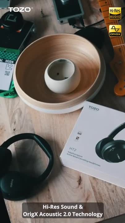 Creator reviewing TOZO HT2 Hi-Res headphones