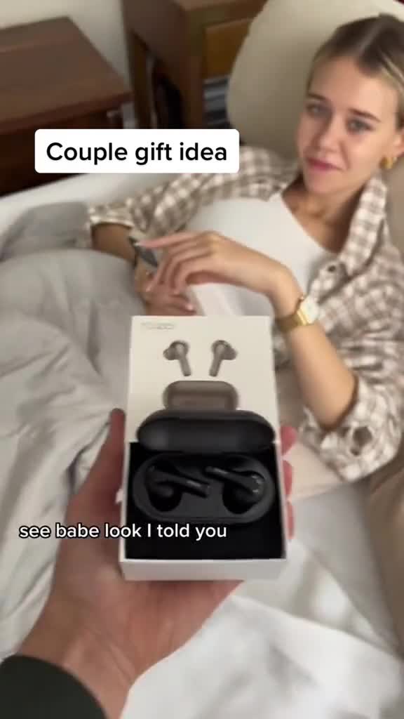 Couple sharing TOZO earbuds